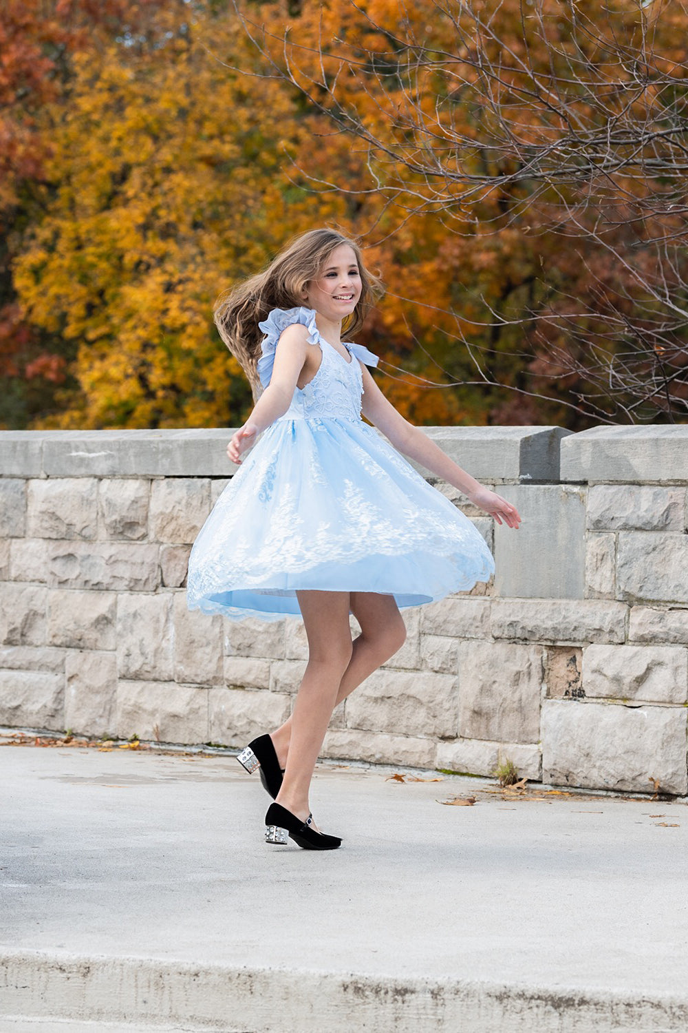 Pretty girl wearing Megan 3D Lace Sparkly Party Dress in Ice Blue-by Miele Moda Boutique