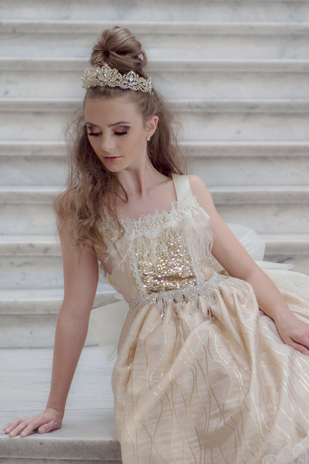 Pretty girl wearing Remi Rhinestones Gold Sparkly Metal Tiara-by Miele Moda Boutique