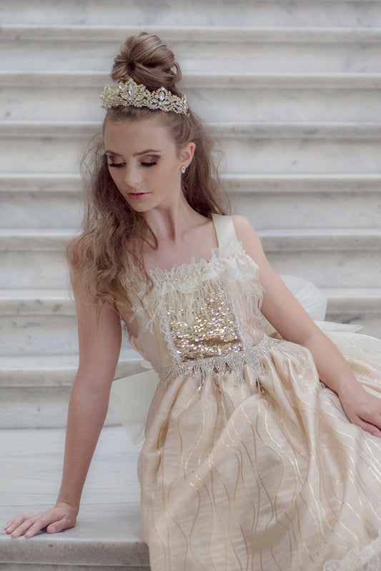 Pretty girl wearing Remi Rhinestones Gold Sparkly Metal Tiara-by Miele Moda Boutique