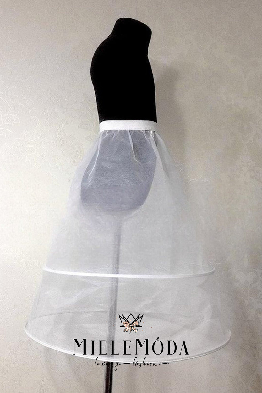White petticoat on a mannequin with 'Miele Modá' branding against a plain background