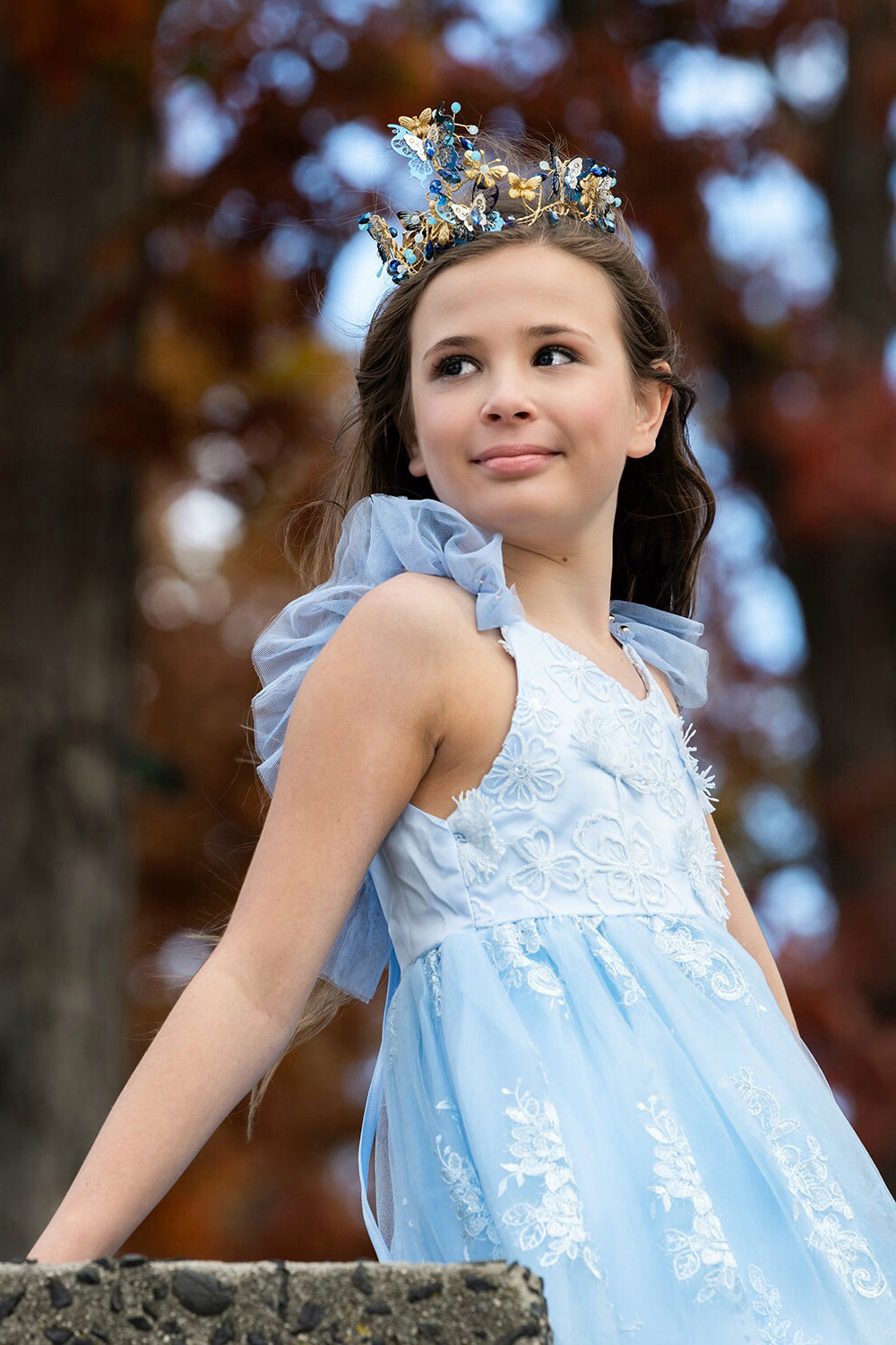 Pretty girl wearing Megan 3D Lace Sparkly Party Dress in Ice Blue-by Miele Moda Boutique