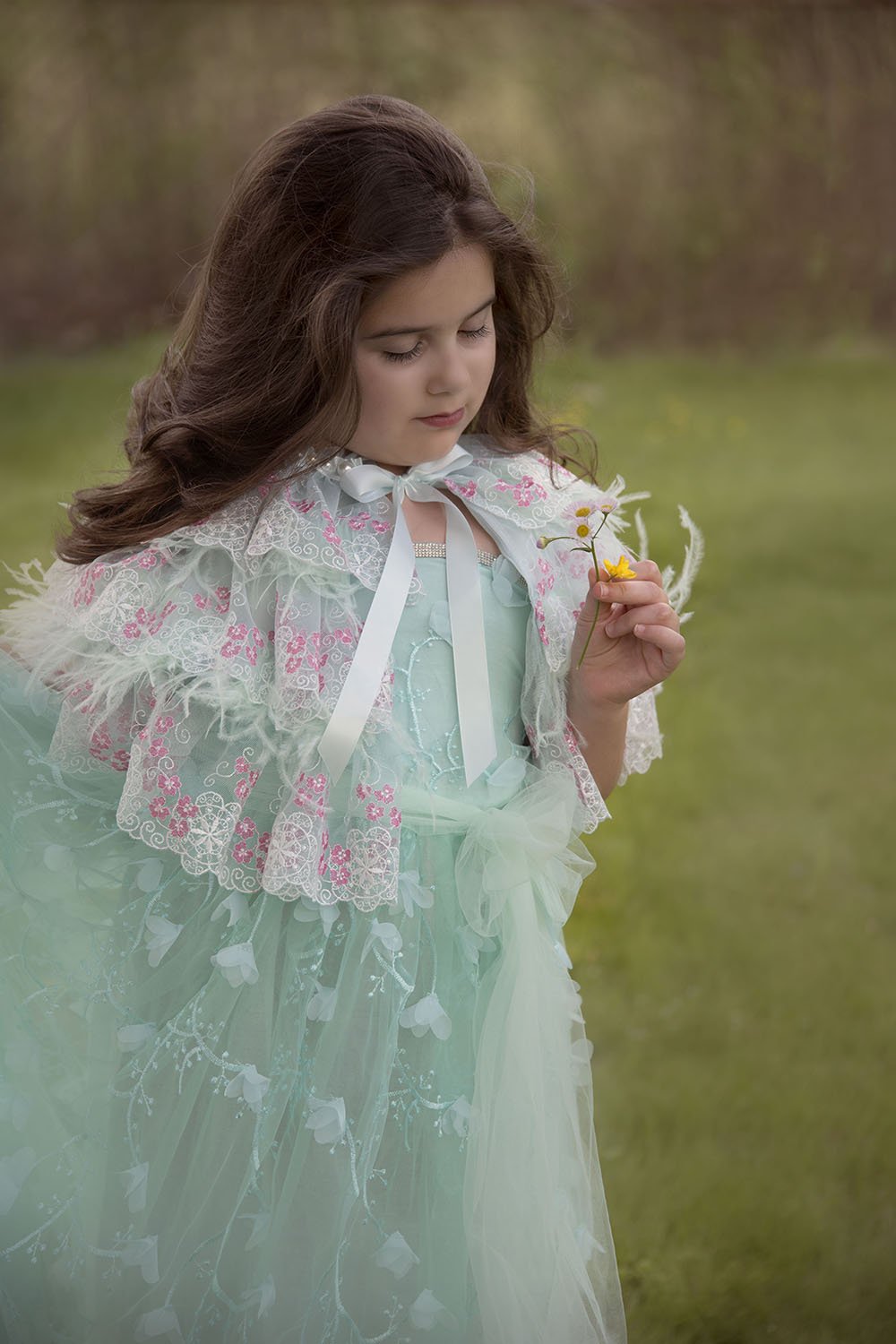 Pretty girl wearing Sabinna Deluxe Lace Feathers Mint Girl Fashion Cape-by Miele Moda Boutique
