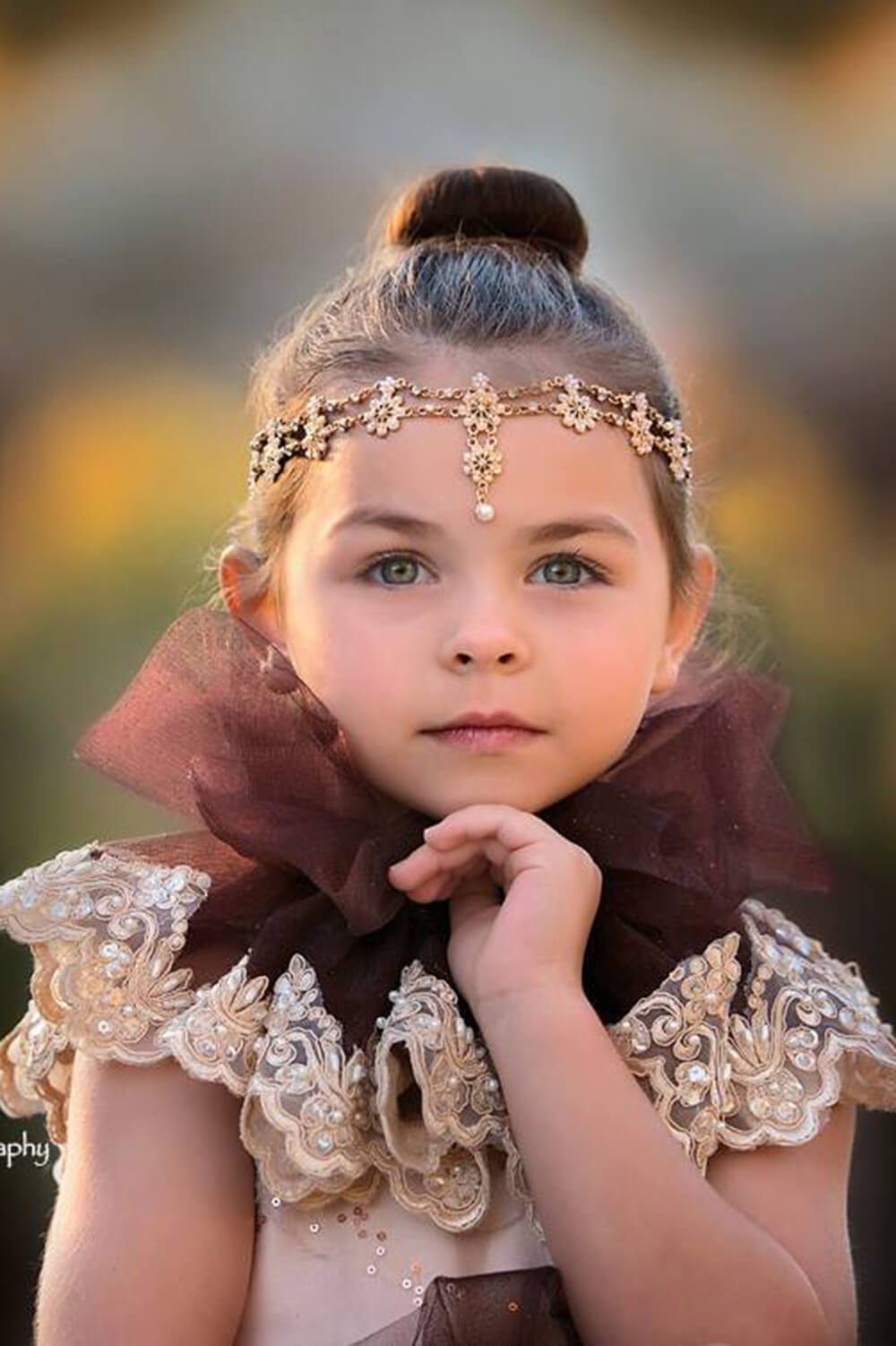Pretty girl wearing Majesty Teardrop Gold Flowers Girl Headband-by Miele Moda Boutique