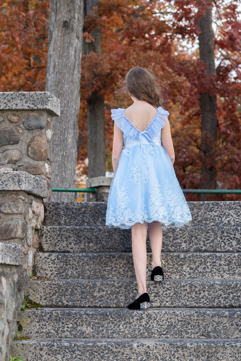 Pretty girl wearing Megan 3D Lace Sparkly Party Dress in Ice Blue-by Miele Moda Boutique