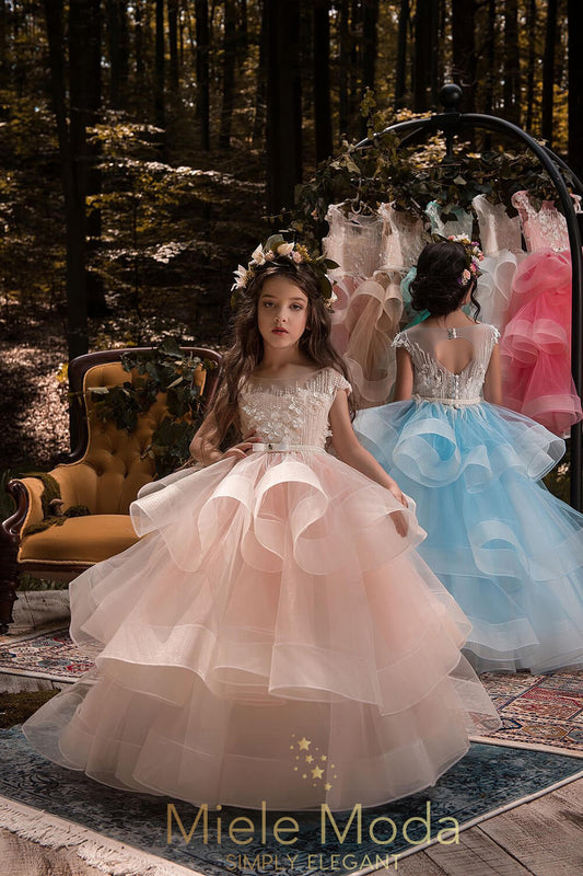 Pretty girl wearing Penelope Couture Dress-by Miele Moda Boutique