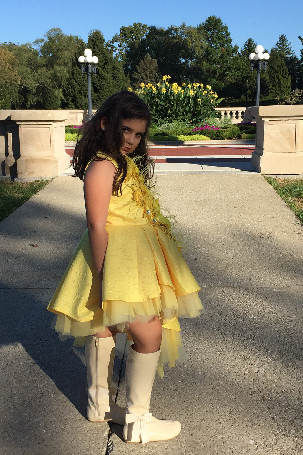 Pretty girl wearing Solange High Low Flower Girl Dress and Cape-by Miele Moda Boutique
