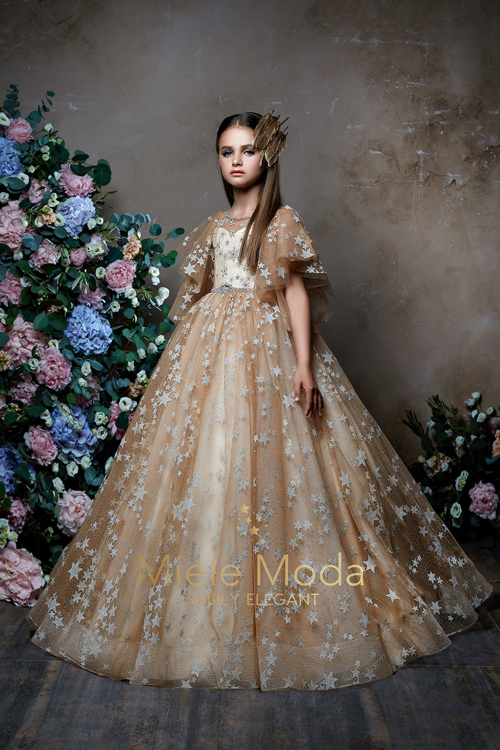 Pretty girl wearing Stellara Sparkly Stars Flower Girl Dress-by Miele Moda Boutique
